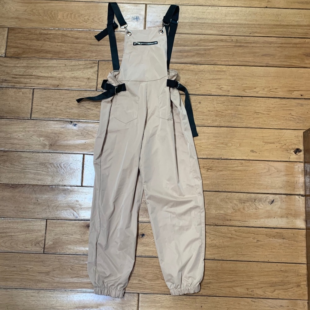 Beige and black overalls